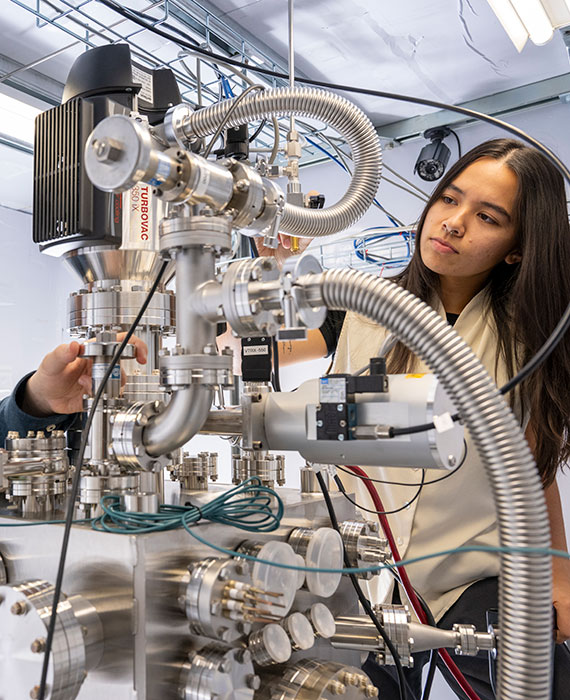 Scientists with microscope
